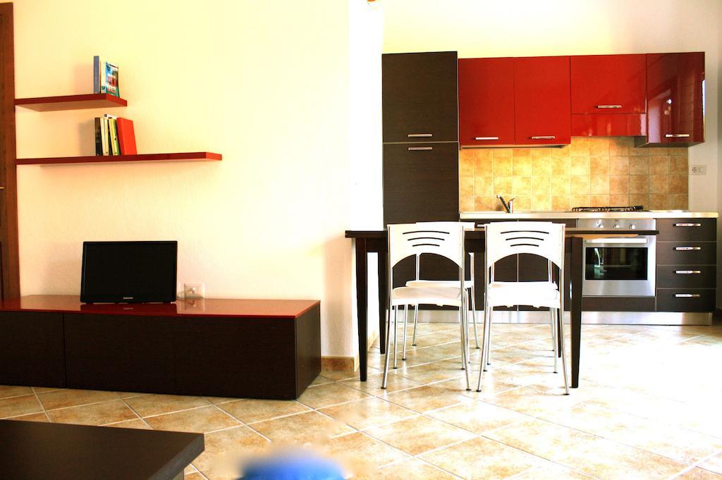 Aparthotel Residenze L'Isola Surf House à Porto Pollo Chambre photo